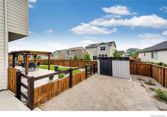 1191 Horsetail Loop, Elizabeth, CO 80107 - fenced backyard with a residential view, a pergola, and a patio