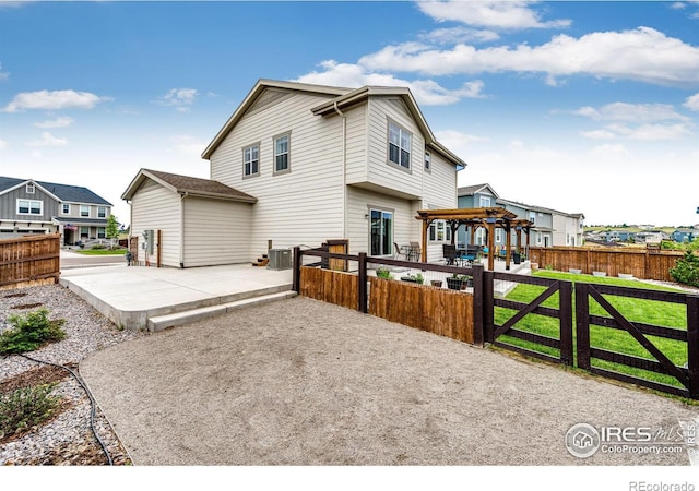 1191 Horsetail Loop, Elizabeth, CO 80107 - back of property with a patio area, a pergola, a residential view, and cooling unit