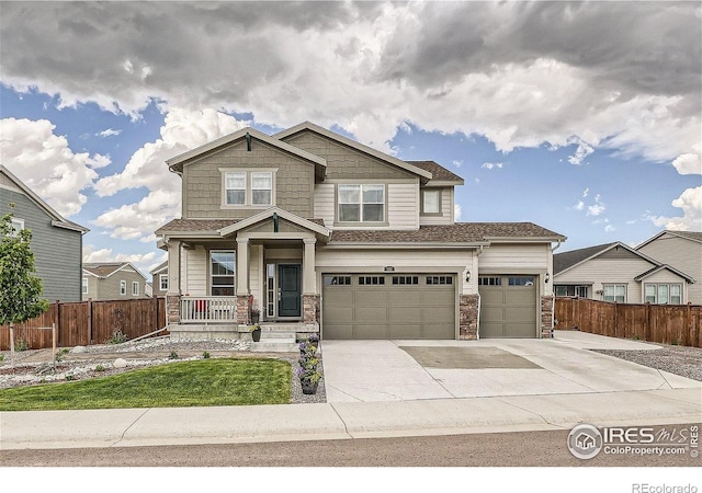 1191 Horsetail Loop, Elizabeth, CO 80107 - craftsman inspired home with covered porch, concrete driveway, stone siding, and a garage