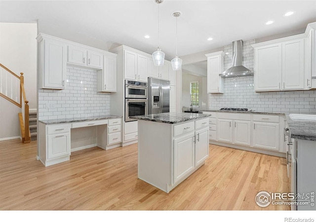10216 Sandy Ridge Ct, Firestone, CO 80504 - kitchen with stainless steel appliances, wall chimney range hood, light wood-style floors, decorative backsplash, and recessed lighting