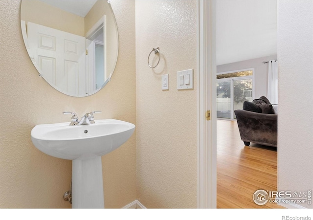 10216 Sandy Ridge Ct, Firestone, CO 80504 - bathroom featuring wood finished floors and a textured wall