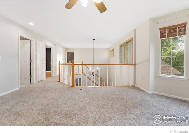 10216 Sandy Ridge Ct, Firestone, CO 80504 - carpeted spare room with ceiling fan, recessed lighting, and a chandelier