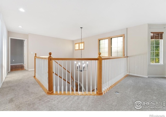 10216 Sandy Ridge Ct, Firestone, CO 80504 - hallway with carpet flooring, baseboards, an upstairs landing, and recessed lighting