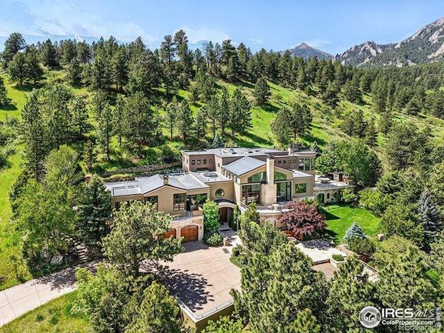 45 Bellevue Dr, Boulder, CO 80302 - view of subject property featuring a heavily wooded area and mountains