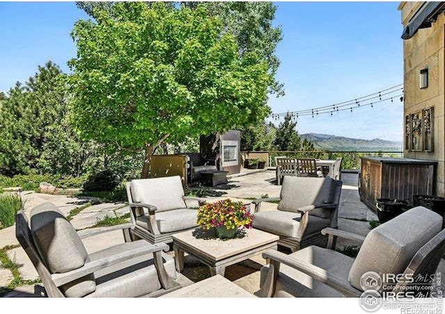 45 Bellevue Dr, Boulder, CO 80302 - view of patio / terrace with an outdoor living space with a fireplace and a mountain view