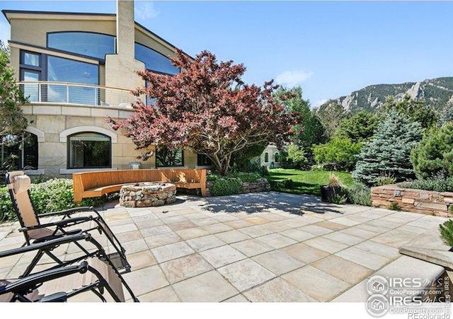45 Bellevue Dr, Boulder, CO 80302 - view of patio / terrace featuring an outdoor fire pit and a mountain view