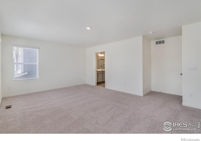 250 Chardon Ave, Brighton, CO 80601 - carpeted empty room featuring baseboards and recessed lighting