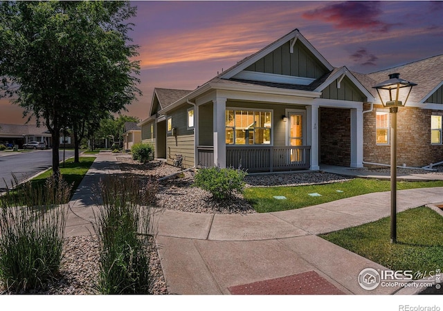4751 Pleasant Oak Dr Unit A28, Fort Collins, CO 80525 - view of front of property with board and batten siding and a porch