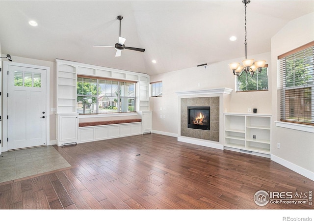 4751 Pleasant Oak Dr Unit A28, Fort Collins, CO 80525 - unfurnished living room with vaulted ceiling, ceiling fan, a chandelier, dark wood-style floors, and baseboards