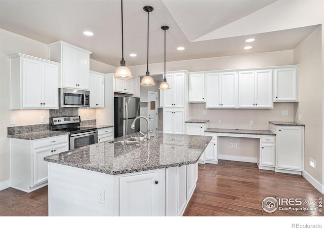 4751 Pleasant Oak Dr Unit A28, Fort Collins, CO 80525 - kitchen featuring appliances with stainless steel finishes, a sink, dark wood-style floors, white cabinets, and lofted ceiling