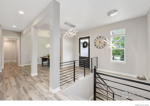 5966 Sunny Crest Dr, Timnath, CO 80547 - corridor featuring an upstairs landing, wood finished floors, baseboards, and recessed lighting