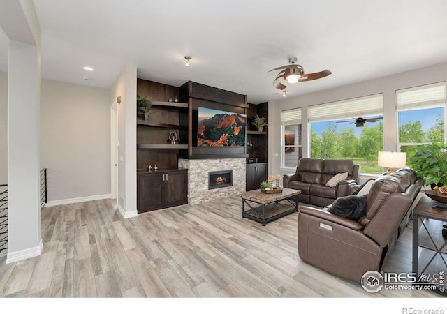 5966 Sunny Crest Dr, Timnath, CO 80547 - living area featuring ceiling fan, light wood finished floors, a fireplace, baseboards, and recessed lighting