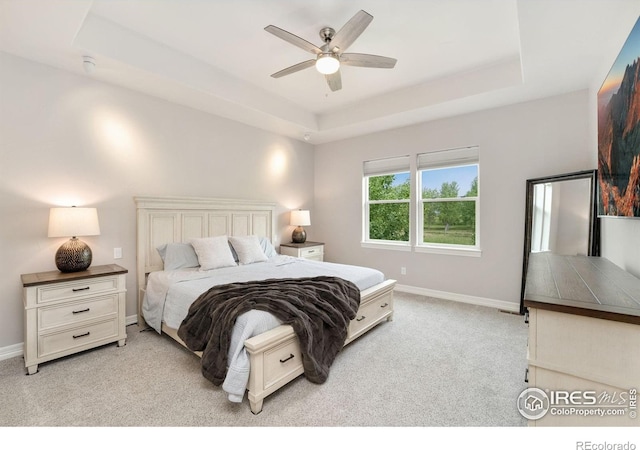 5966 Sunny Crest Dr, Timnath, CO 80547 - bedroom featuring light colored carpet, a raised ceiling, baseboards, and ceiling fan