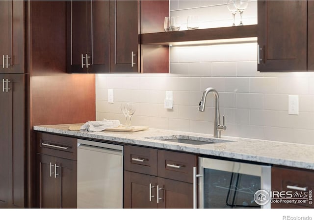 5966 Sunny Crest Dr, Timnath, CO 80547 - kitchen featuring wine cooler, a sink, dark brown cabinets, tasteful backsplash, and dishwashing machine