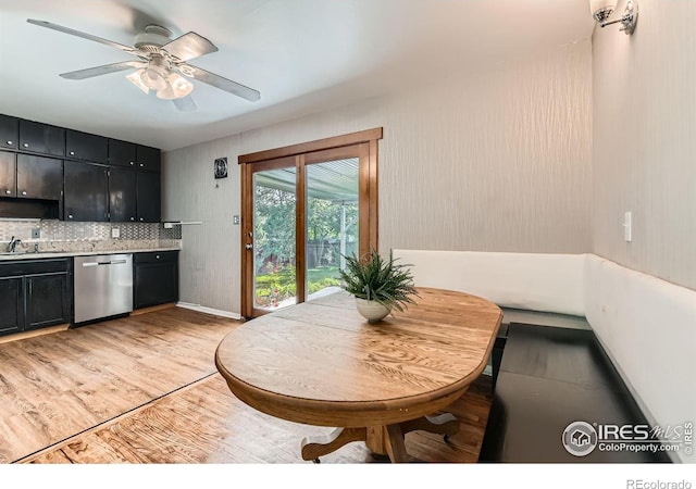 510 S 46th St, Boulder, CO 80305 - kitchen with dishwasher, dark cabinetry, decorative backsplash, ceiling fan, and light wood-style floors