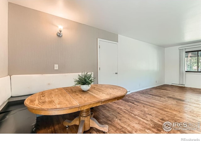 510 S 46th St, Boulder, CO 80305 - dining space with wood finished floors and a baseboard heating unit