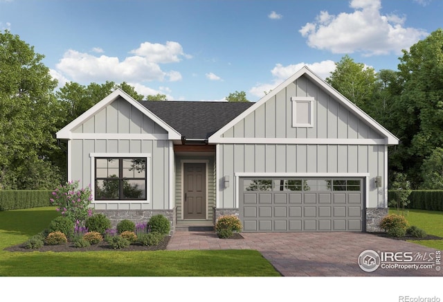 1205 105th Avenue Ct, Greeley, CO 80634 - modern farmhouse style home featuring stone siding, board and batten siding, decorative driveway, and a front lawn