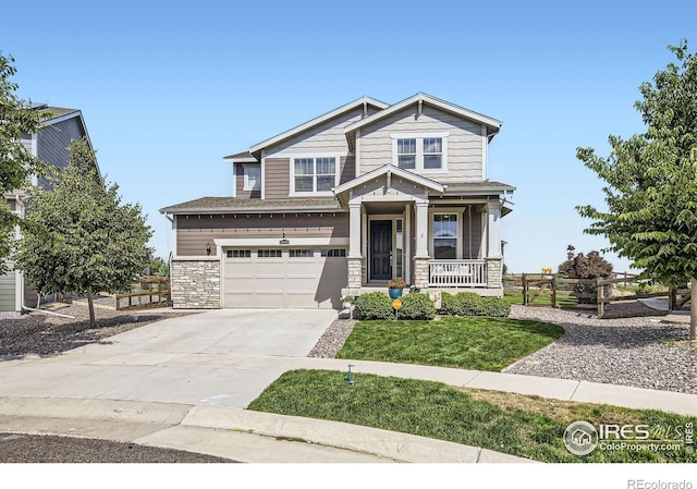 12889 Clearview St, Firestone, CO 80504 - craftsman house with concrete driveway, stone siding, a garage, and covered porch