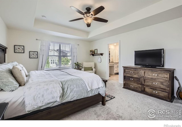 12889 Clearview St, Firestone, CO 80504 - bedroom featuring carpet, a raised ceiling, a ceiling fan, and connected bathroom