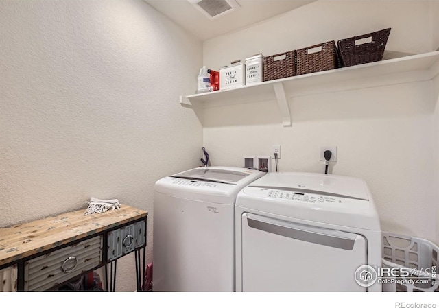 12889 Clearview St, Firestone, CO 80504 - laundry area featuring independent washer and dryer and a textured wall