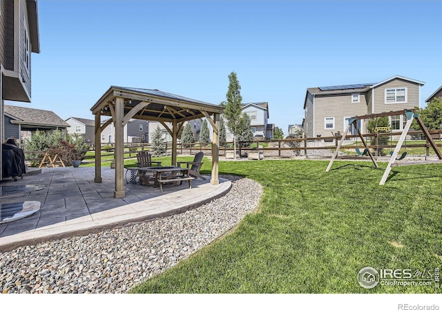 12889 Clearview St, Firestone, CO 80504 - view of yard featuring a gazebo, a patio, a playground, and a residential view