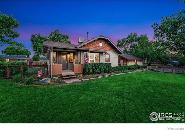 4900 W 6th Ave, Denver, CO 80204 - back of property at dusk featuring a porch and central air condition unit