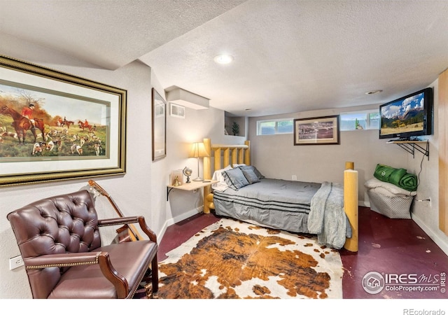 4900 W 6th Ave, Denver, CO 80204 - bedroom featuring a textured ceiling and baseboards