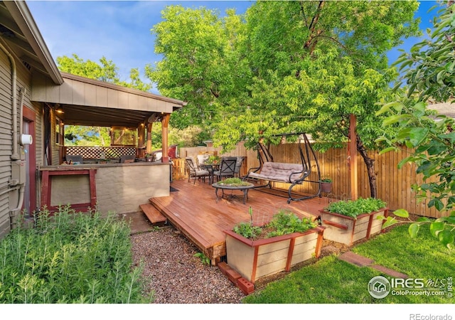 4900 W 6th Ave, Denver, CO 80204 - wooden deck with a fenced backyard
