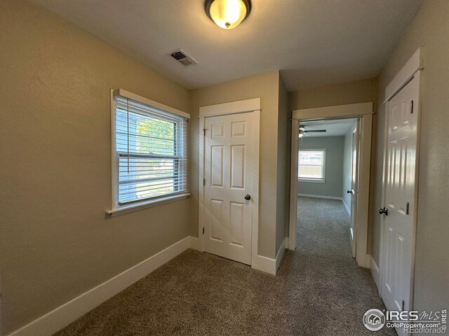 611 N 2nd St, Sterling, CO 80751 - corridor featuring carpet floors and baseboards