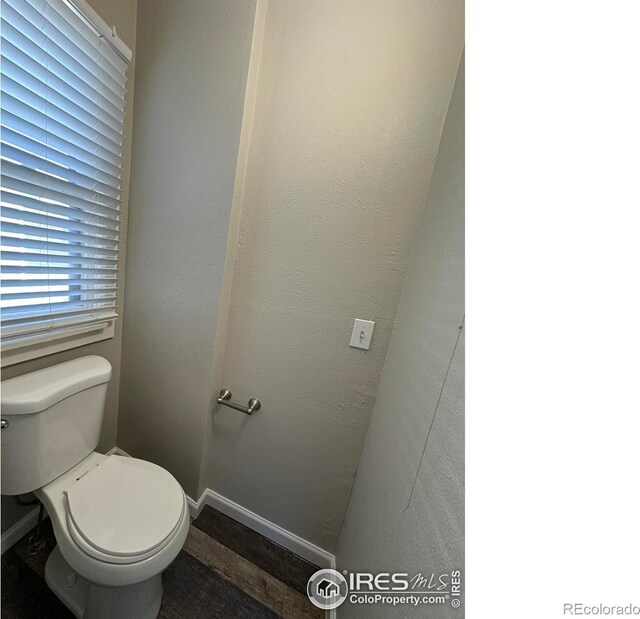611 N 2nd St, Sterling, CO 80751 - bathroom with toilet and baseboards