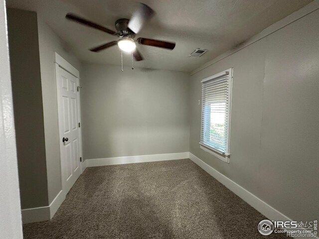 611 N 2nd St, Sterling, CO 80751 - empty room featuring carpet, a ceiling fan, and baseboards