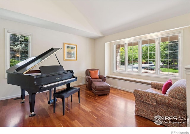 4483 S Meadow Dr, Boulder, CO 80301 - living area with wood finished floors, healthy amount of natural light, vaulted ceiling, and baseboards
