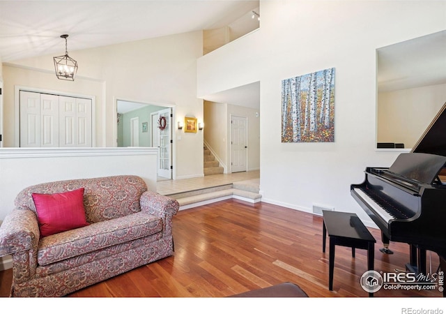4483 S Meadow Dr, Boulder, CO 80301 - living room featuring stairs, wood finished floors, vaulted ceiling, and baseboards
