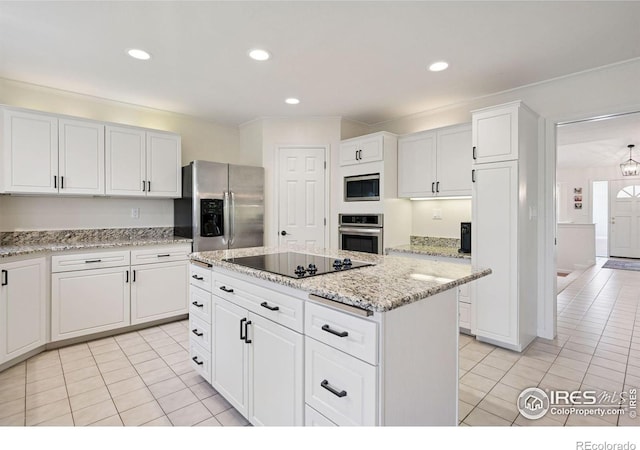 4483 S Meadow Dr, Boulder, CO 80301 - kitchen featuring stainless steel appliances, light tile patterned floors, crown molding, white cabinets, and a kitchen island
