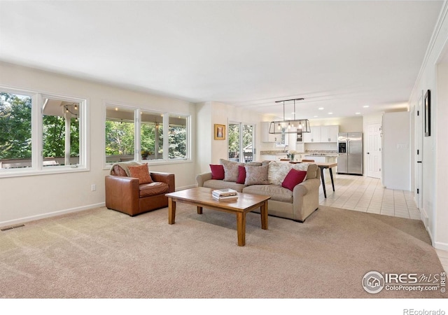 4483 S Meadow Dr, Boulder, CO 80301 - living area with light colored carpet, baseboards, recessed lighting, and a chandelier