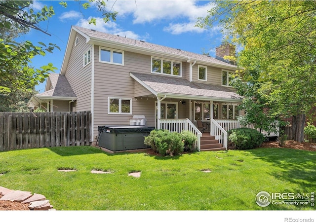4483 S Meadow Dr, Boulder, CO 80301 - back of property with a hot tub, a chimney, and a shingled roof
