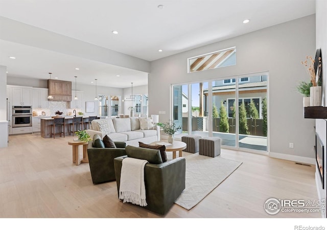 1425 Burt Ave, Berthoud, CO 80513 - living area featuring light wood-style flooring, recessed lighting, and baseboards