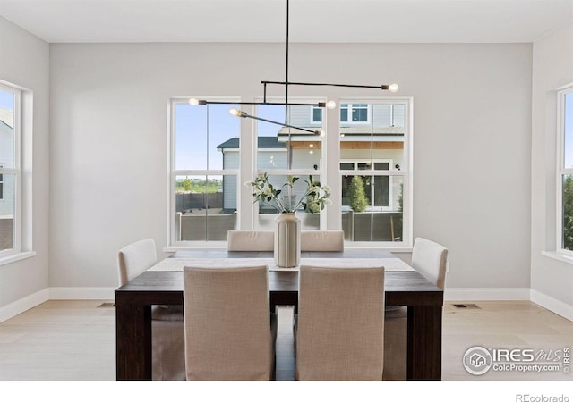 1425 Burt Ave, Berthoud, CO 80513 - dining space featuring light wood-style floors and baseboards