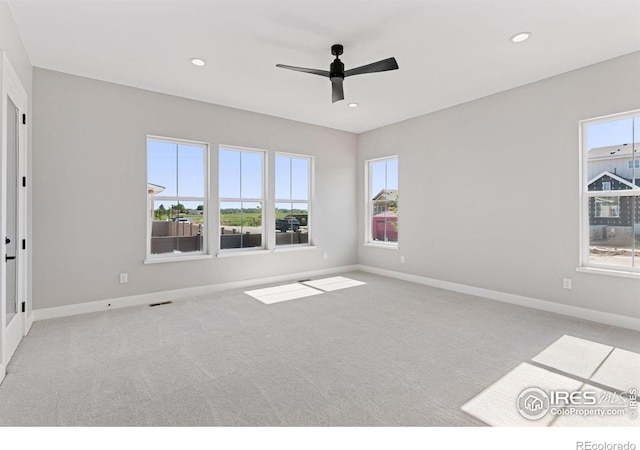 1425 Burt Ave, Berthoud, CO 80513 - carpeted empty room with plenty of natural light, baseboards, ceiling fan, and recessed lighting