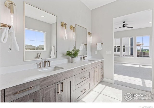 1425 Burt Ave, Berthoud, CO 80513 - full bathroom with double vanity and a ceiling fan