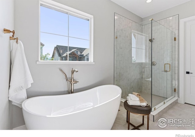 1425 Burt Ave, Berthoud, CO 80513 - bathroom with a soaking tub and a shower stall