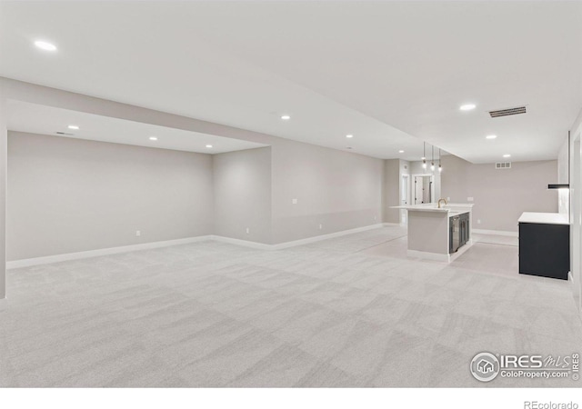 1425 Burt Ave, Berthoud, CO 80513 - unfurnished living room featuring recessed lighting, light carpet, and baseboards