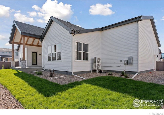 1425 Burt Ave, Berthoud, CO 80513 - rear view of property featuring a yard, a cooling unit, and covered porch