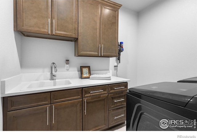 505 Nesting Eagles Way, Berthoud, CO 80513 - laundry area with cabinet space and washing machine and clothes dryer