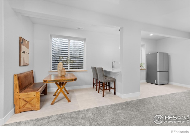 505 Nesting Eagles Way, Berthoud, CO 80513 - dining room with carpet, baseboards, and wet bar