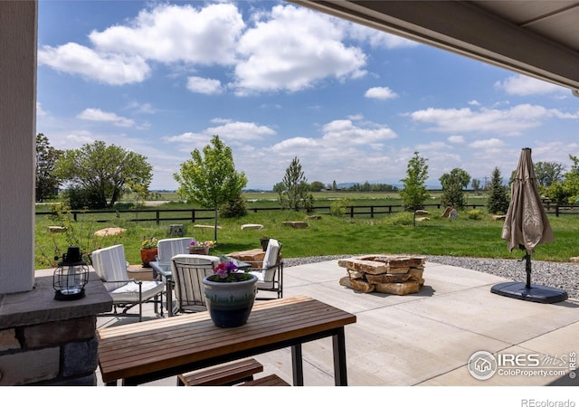 505 Nesting Eagles Way, Berthoud, CO 80513 - view of patio / terrace with a fire pit and a view of countryside