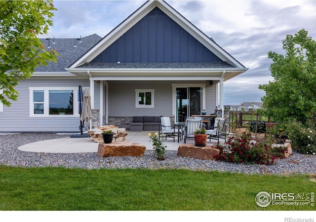 505 Nesting Eagles Way, Berthoud, CO 80513 - rear view of house featuring board and batten siding, a patio area, and outdoor lounge area