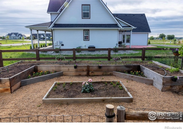 505 Nesting Eagles Way, Berthoud, CO 80513 - view of property exterior featuring a vegetable garden and a shingled roof