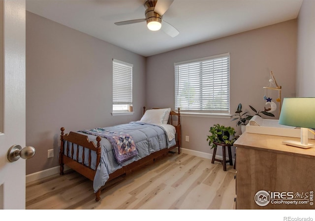 5609 Mount Sanitas Ave, Longmont, CO 80503 - bedroom with light wood-style floors, baseboards, and a ceiling fan