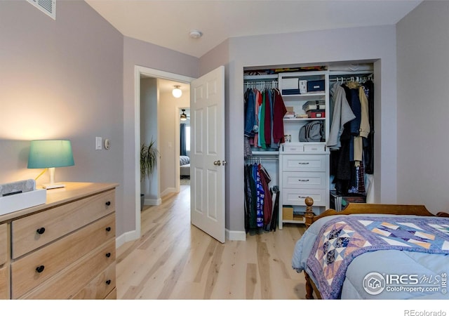 5609 Mount Sanitas Ave, Longmont, CO 80503 - bedroom featuring light wood-style flooring, a closet, and baseboards